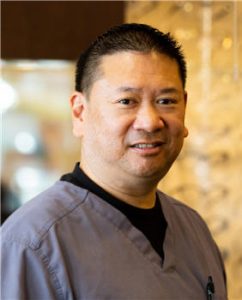 Dr. Keith Chow smiling.